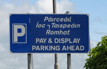 Irish Gaelic road sign showing Tironian et and ampersand