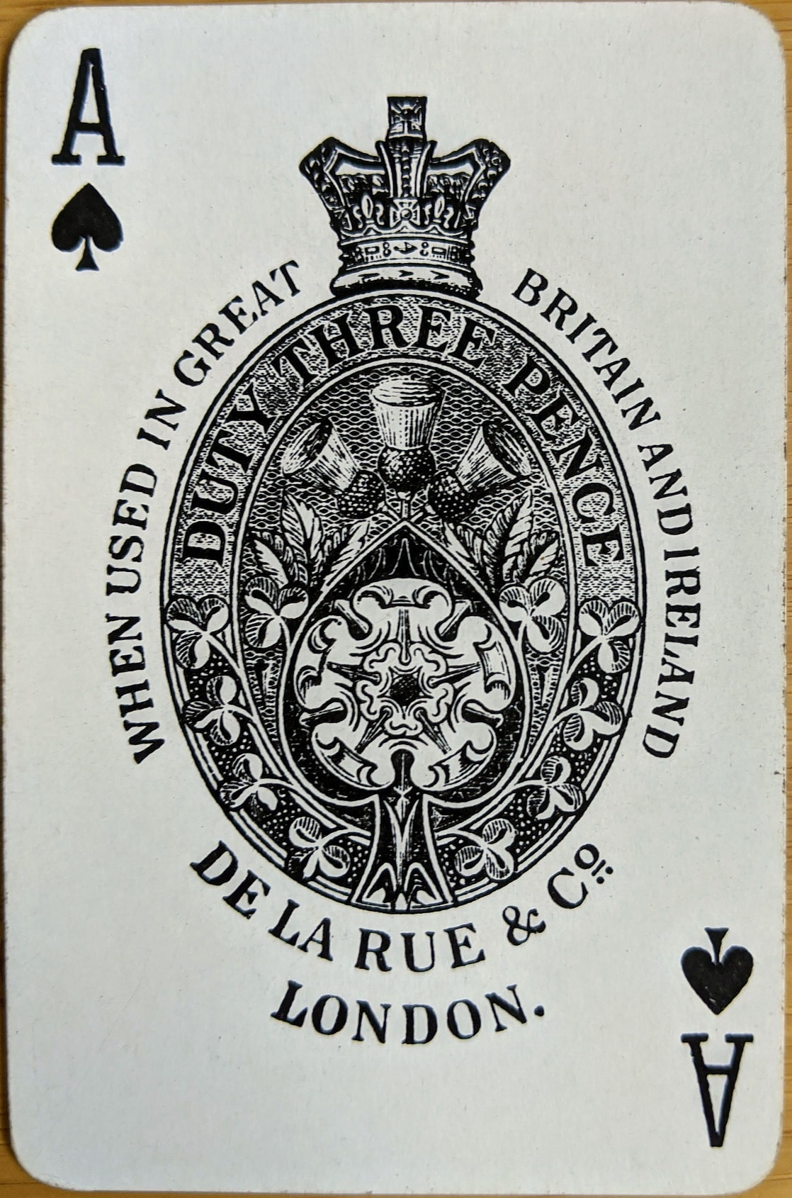 Playing card showing abbreviation for "Company"
