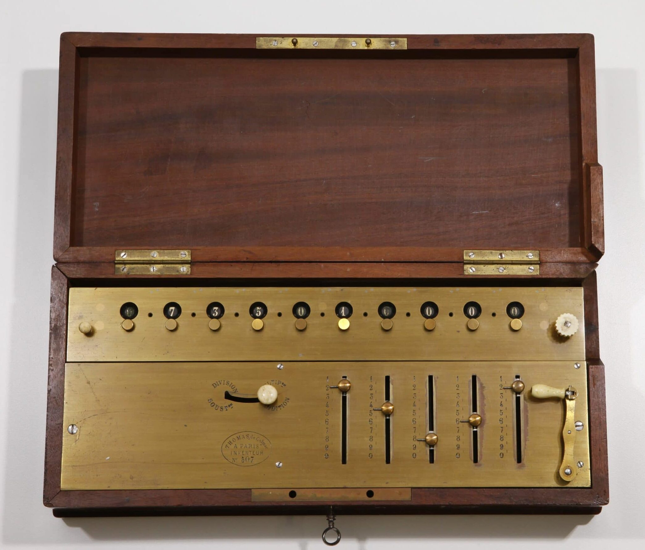 An arithmometer in a protective wooden case, circa 1863. (<a href="http://doi.org/10.21264/ethz-a-000000326">Public domain image courtesy of Sammlung wissenschaftlicher Instrumente und Lehrmittel, ETH-Bibliothek, ETH Zürich</a>.)
